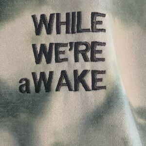 WHILE WE’RE aWAKE multi strand tie dye hoodie.